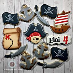 decorated cookies with pirate decorations on a wooden background for a birthday or baby's first birthday