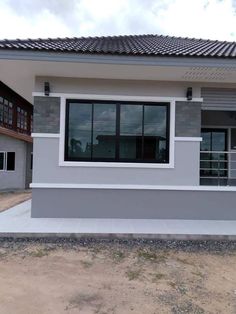 a small house is shown in the middle of an empty lot