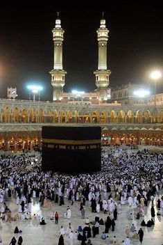 many people are gathered around the kabab at night