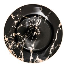 black and white marbled plate with gold trimmings on the rim, against a white background