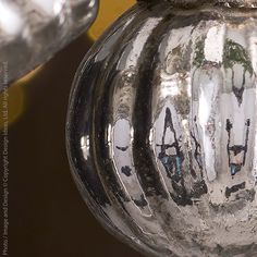 a glass vase with the word love written on it