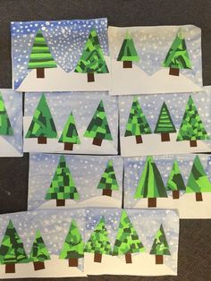 several pieces of paper cut out to look like christmas trees