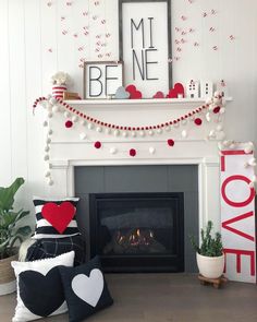 a living room decorated for valentine's day with red, white and black decorations