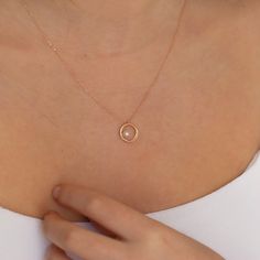 "Dainty 14k Gold Circle Necklace with Pearl, Gold Pearl Jewelry, Solid Minimal Pearl Pendant, Wedding Accessory, Valentines day Gift for Her All of our products has the stamp \"585\" on them. (which states that this is real gold) Our product weighs 1.99 gr and the chain length is 42 cm. There may be +/- 0.15 change in gram information due to production. Your products will be shipped with free shipping UPS express within 1-3 business days. Quality control has been done. Our products are Anti Alle Simple Pearl Necklace, Gold Pearl Jewelry, Necklace With Pearl, Single Pearl Necklace, Gold Circle Necklace, Evil Eye Necklace Gold, Ring Pearl, Pearl Drop Necklace