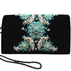 "Stunning black velvet evening clutch bag with detailed and intricately embroidered sparkly silver and turquoise metallic flower and inlaid with genuine turquoise stone. It elevates any outfit to the spectacular. Sparkle away at the rodeo and any western themed event! Expertly hand embroidered by master zardozi artisans to create and opulent and dazzling 3D effect. Sparkles like a perfect little jewel box. DETAILS: - Flap over magnetic closure - Black velvet - measures 8\" H x 5\" W x 2.5 \" D. Elegant Turquoise Bag For Formal Occasions, Turquoise Rectangular Shoulder Bag For Evening, Turquoise Rectangular Evening Shoulder Bag, Elegant Turquoise Bag For Gift, Turquoise Bag, Embellished Purses, Turquoise And Black, Floral Purse, Jewel Box