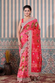 Buy pink Patola silk sari online in USA with embroidered scalloped border. Make a fashion statement at weddings with stunning designer sarees, embroidered sarees with blouse, wedding sarees, handloom sarees from Pure Elegance Indian fashion store in USA.-full view Pink Raw Silk Pre-draped Saree With Dupatta, Festive Pink Raw Silk Pre-draped Saree, Pink Raw Silk Pre-draped Saree With Resham Embroidery, Silk Pre-draped Saree With Embroidered Border For Puja, Traditional Pink Pre-draped Saree With Embroidered Border, Bollywood Style Pink Blouse Piece With Embroidered Border, Bollywood Style Embroidered Pink Pre-draped Saree, Bollywood Style Pink Embroidered Pre-draped Saree, Festive Pink Blouse With Embroidered Border