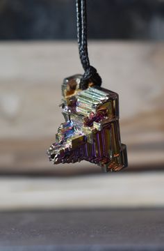 Bismuth Bead Pendant Gold Copper Rainbow Crystal Pendant Bismuth Necklace 78.49 carats 29 x 21 x 22 Bismuth is a crystalline, brittle metal that is silvery-white with an iridescent hue. As an elemental metal, its number is 83 on the Periodic Table. Bismuth is often lab-created. Rainbow colored Bismuth can be a wonderful stone to use for focus, visualization and shamanic journeying. It can prevent you from becoming overwhelmed by all of your responsibilities while at the same time increasing your Adjustable Silver Necklace With Mineral Crystal, Iridescent Crystal Pendant For Jewelry Making, Iridescent Crystal Pendant Necklace For Jewelry Making, Iridescent Metal Necklace Gift, Faceted Metal Necklace For Gifts, Faceted Metal Necklace For Gift, Iridescent Pendant Crystal Necklace For Gift, Iridescent Crystal Pendant Necklace For Gift, Nickel Free Silver Mineral Crystal Necklace