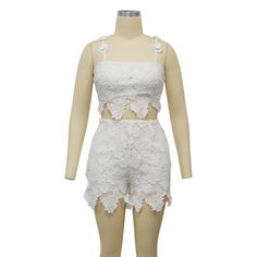 Indulge in luxury with our Feminine Lace Applique' Shorts Set. Featuring delicate lace appliques, this set exudes elegance and sophistication. Perfect for a romantic evening or a special occasion, this set will make you feel confident and stylish. Elevate your wardrobe with this exclusive piece. Sizes S-2XL Decoration Zip Up , Lace Length Above Knee, Mini Style Sexy & Club Fabric Type Blended fabrics , Lace Material Polyester , Spandex Neckline Strappy Pattern Type Solid Sleeve Length Sleeveless Season Summer Fabric Non-Stretch Black Jumpsuit Dress, Lace Material, Romantic Evening, Curvy Dress, Crop Top Sweater, Summer Fabrics, Short Set, Basic Tops, Mini Fashion