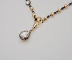 Elevate your jewelry collection with our exclusive Trio Harmony Gift Set, expertly crafted in 14K gold and featuring stunning moissanite stones. This set includes a chic 16" ball chain necklace adorned with a 0.25 ct moissanite, a dazzling 3 carat pear moissanite pendant, and a pair of 0.5 ct round moissanite earrings, each piece designed to complement each other or stand alone with elegance. Purchasing this set saves you $450, offering the set at a total value of $3877.40. Perfect for gifting o Classic Rose Gold Jewelry With Rose Cut Diamonds, Rose Cut Diamond Briolette Jewelry For Anniversary, Rose Cut Briolette Diamond Jewelry, Briolette Rose Cut Diamond Jewelry, Teardrop White Gold Jewelry With Rose Cut Diamonds, Diamond White Rose Cut Briolette Jewelry, Classic Teardrop Rose Cut Diamond Jewelry, Yellow Gold Diamond Necklace With Rose Cut Briolette, Rose Gold Briolette Diamond Jewelry