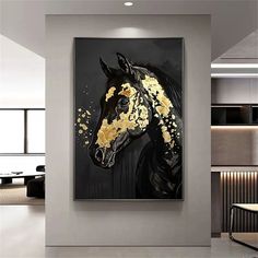 a black and gold horse painting hanging on a wall