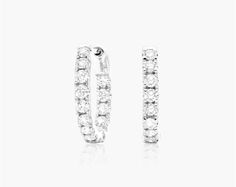 14K White Gold Inside Out Round Hoops, 1/2 Inch Diameter (0.50 ctw.). Make a grand entrance with these chic pair of diamond round hoops! Exquisitely crafted in 14k white gold with highly polished smooth finish. The hoops feature an inside out design prong set with round brilliant cut diamonds, nicely secured with comfortable hinged snapbacks. These gorgeous hoop earrings are a staple for every jewelry connoisseur! Classic White Hoop Earrings With Single Cut Diamonds, White Hoop Earrings With Single Cut Diamonds For Wedding, White Diamond Hoop Earrings For Wedding, White Single Cut Diamond Hoop Earrings For Wedding, White Hoop Diamond Earrings With Single Cut, Sparkling White Gold Round Cut Hoop Earrings, White Gold Round Hoop Earrings With Diamond Cut, Modern White Brilliant Cut Hoop Earrings, Diamond White Round Cut Diamond Hoop Earrings