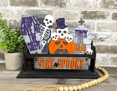 a halloween display with pumpkins and skeleton decorations