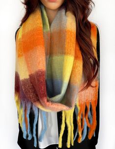 "Ladies Yellow Orange checked blanket scarf, oversized rainbow wool scarf / thick Winter shawl wrap. Chunky, warm Winter scarf that is long, large, thick and fluffy! Multicolour colour block tartan print scarf shawl for women. Oversized scarf or chunky wrap that makes the perfect ladies gift or \"gift for her\"! Easy to wear; this multi purpose vibrant and bright colourful scarf can be worn as a shawl wrap, big wrap scarf, infinity scarf or wearable blanket. Beautifully designed quality wool scarf in a blend of gorgeous colours - yellow, orange, blue, burgundy etc - the perfect accessory for colder days. Stunning premium quality womens scarf; very Limited Edition, at this incredible low price! - Thick, warm and cosy; luxury premium quality soft delicate feel. - On trend; really plush desig Checked Blanket, Colourful Scarf, Winter Wrap, Scarf Infinity, Oversized Blanket, Winter Shawl, Tartan Scarf, Pretty Scarves, Colorful Scarf