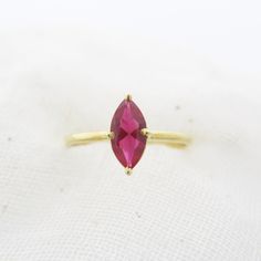 Exquisite Marquise Lab-Grown Ruby Ring: Timeless Elegance. Discover the allure of our lab-grown Marquise Ruby Ring, a symbol of everlasting elegance and sophistication. Crafted to perfection for a touch of luxury. Gemstone  ✦ 𝗟𝗮𝗯 𝗚𝗿𝗼𝘄𝗻 / 𝗖𝗿𝗲𝗮𝘁𝗲𝗱 𝗥𝘂𝗯𝘆 - 𝗠𝗮𝗻 𝗠𝗮𝗱𝗲 ✦ Marquise Cut -  AAA clarity - eye clean ✦ Brilliant Round Cut - F/ G / H  ✦ VS / SI ( 1 - 2 ) - eye clean ✦ Excellent / Very Good Cut ✦ Size (mm) : 6/3 ,  8/4,  10/5 mm  (Size options - approx) ✦ Setting :  𝗣? Marquise Cut Yellow Gold Birthstone Ring For Gift, Yellow Gold Marquise Cut Birthstone Ring For Gift, Gift Marquise Topaz Ring With Prong Setting, Gift Ruby Ring With Marquise Cut Birthstone, Marquise Ruby Ring With Accent Stones As Gift, Gift Marquise Cut Ruby Ring With Prong Setting, Marquise Ruby Promise Ring With Prong Setting, Gift Marquise Cut Birthstone Ring With Prong Setting, Marquise Ruby Ring With Prong Setting In 14k Gold