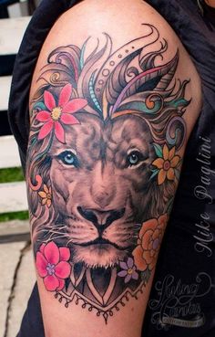 a woman with a lion tattoo on her arm