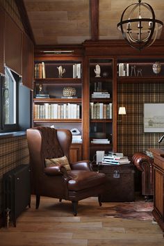 a living room filled with furniture and bookshelves