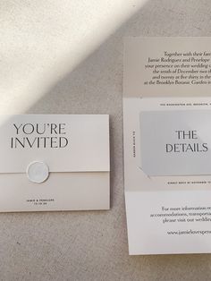 two brochures are laying on the floor next to each other, one has a button that says you're invited