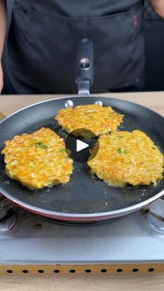 someone is frying some food in a skillet