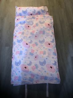 a baby sleeping bag on the floor