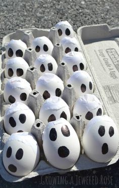 an egg carton filled with lots of white eggs covered in black polka dot dots