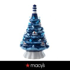 a ceramic christmas tree with blue lights on it