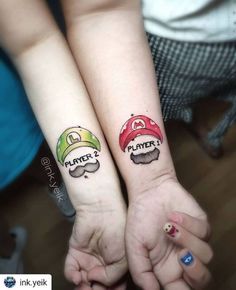 two people with matching tattoos on their arms