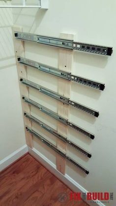 a wall mounted shelf with metal brackets on it