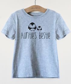 We love these Auntie Baby Clothes available on Etsy. This Aunties Bestie kids shirt is such a cute shirt for your niece or nephew or as a gift from your favorite Aunt. Cool kids shirt with penguin graphic for the best niece or nephew ever. Cute gender neutral kids shirt for birthday, Christmas, Christening or any other occasion.  Available as kids shirt or baby bodysuit so also makes a great pregnancy announcement or gender reveal gift for your sister or sister in law. Auntie Baby Clothes, Farm Shirts, Auntie Baby, Safari Kids, Animal Kingdom Shirts, Farm Kids, Farmer Shirt, Farm Gifts, Husband Shirts