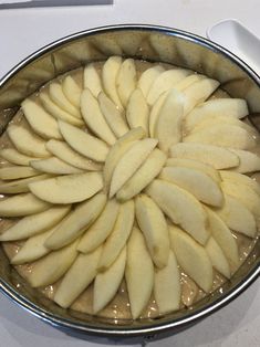 an apple pie is shown in a pan on the counter top, ready to be eaten