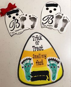 three handprints with footprints and feet on them, one is for trick or treat smell my feet