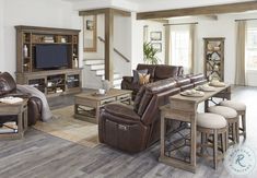 a living room filled with furniture and a flat screen tv