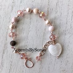 Rose gold bracelet with pink opals , pink shell pearls, pink quartz crystals, and a beautiful shell heart shaped charm! If you love pink this pink opal bracelet has you covered!  Great gift idea!!  Pink Opal is a love stone with a deep connection to the Heart Chakra. It works to heal our emotions, allowing our hearts to open to love. Pink Opal is often referred to as "The Stone of Resolution" as it works to heal our emotional wounds and deep hidden fears enabling us to resolve and let them go. T Gold Daisy Earrings, Open To Love, Gold Arm Band, Rose Bracelet, Gold Armband, Daisy Earrings, Opal Bracelet, Bracelet Beaded, Rose Gold Bracelet