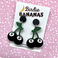 ... Cherry 8 Ball Earrings Features  Layered acrylic cherry shaped 8 balls with green glitter cherry stems topped with a matching black stud.  Very lightweight and easy to wear Materials: acrylic, surgical steel posts Colours : Black , Red, Green Size Length:  6.5cm Width: 3.5cm Shipping and Handling I aim to ship same or next business day. Shipping is standard and generally takes 2-14 business days.  If you require an express service please upgrade shipping at checkout. International standard s Cherry 8 Ball, Rockabilly Earrings, Punk Tattoo, Earrings Punk, Black Stud, Rock N’roll, Ball Earrings, 8 Ball, Green Glitter