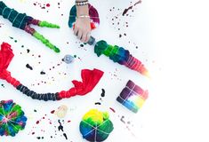 colorful objects are scattered on the floor with paint splattered all over them