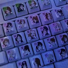 a computer keyboard with anime characters on it