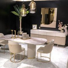 an elegant dining room with marble table and chairs