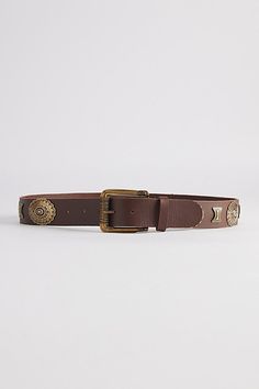 Leather belt with metal embellishments. Adjustable fit belt with a secure buckle closure. Features Embellished Western belt Metal accent belt Adjustable fit Classic buckle closure Content + Care 100% Leather Spot clean Imported Size Length Small: 38" Medium: 40" Large: 42" X-Large: 44" | Embellished Western Belt in Brown, Men's at Urban Outfitters Metal Embellishments, Men's Shoes Accessories, Brown Fits, Western Belt, Western Belts, Women Men Shoes, Metallic Accents, Jeans For Sale, Accessories Shop