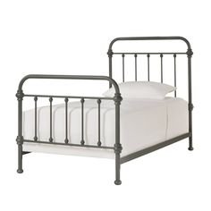 a metal bed frame with white sheets and pillows on it, against a white background