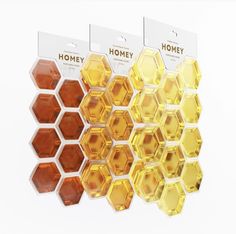 three boxes of honey sitting on top of each other