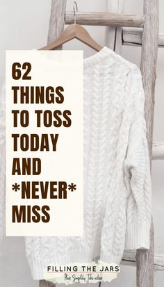 a white sweater hanging on a wooden ladder with the words, 52 things to toss today and never miss