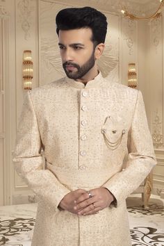 Make your big day even more special with our Mens Sherwani S20-S368! This groom's sherwani is adorned with stunning stones, adding a touch of luxury to your wedding ensemble. It will make you shine on your big day. Beige Naqshi Traditional Wedding Wear, Beige Naqshi Traditional Wear For Wedding, Beige Naqshi Wedding Sets, Beige Naqshi Kurta For Wedding, Designer Naqshi Traditional Wear For Weddings, Beige Naqshi Sherwani For Wedding, Luxury Wedding Suits With Zari Work, Gold Nehru Jacket For Wedding, Designer Dabka Work Wedding Sets