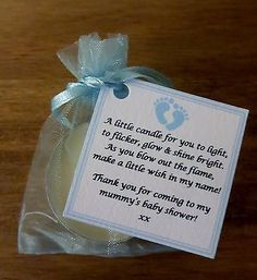 a little candle for you to light it is in a bag with a blue ribbon