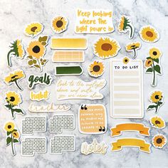 the sunflower stickers have been placed on top of a marble surface with words and phrases