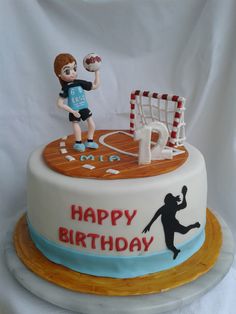 a birthday cake with a boy playing soccer