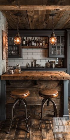 two stools sit at the bar in this rustic style kitchen with brick walls and wood flooring