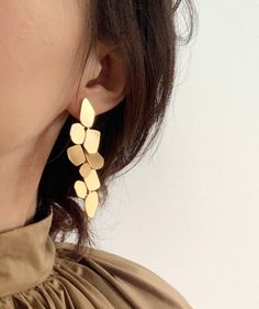 5-star review shop! We have the best handmade earrings at affordable price. Perfect for gift giving 🎁 to you and your love ones. Unique Handmade Matte gold Leaf Statement Drop and Dangle Earrings. You can't find such unique & cool earrings anywhere else! - 100% HANDMADE DESIGN - We turn the inspiration into unique, fun and stylish jewelry design. Eech set is 100% handmade by Cleble. - ALLERGY-FREE / FOR SENSITIVE EARS - Each set uses steel ear wire that is nickel-free, Lead-free, and hypoal Gold Earrings Trendy, Single Statement Earring, Handmade Statement Earrings, Dangling Gold Earrings, Stylish Earrings Unique, Fancy Gold Earrings, Big Earing, Fun Earrings Unique, Unique Earrings Gold