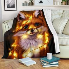 a blanket that has a fox on it with christmas lights in the eyes and head