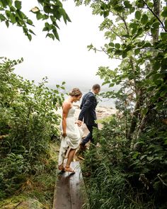 A bride and groom running through the woods. Craftsman Mansion, Lutsen Mn, Lake Of The Woods Minnesota, North Shore Mn Elopement, Minnesota Scenery, North Shore Minnesota Wedding, Lutsen Minnesota, The North Shore Minnesota, Minnesota Lake