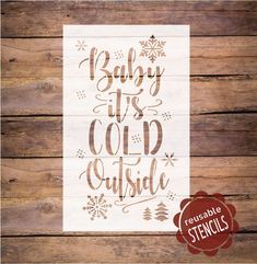 a wooden sign that says baby it's cold outside with snowflakes on it