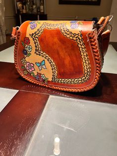 Handmade crosdbody bag from Mexico. Bohemian, very cute Bohemian Hand Painted Shoulder Bag For Everyday Use, Artisan Hand Painted Brown Bags, Bohemian Hand Painted Bags For Daily Use, Artisan Hand-painted Bag, Brown Artisan Saddle Shoulder Bag, Hand Painted Brown Shoulder Bag Gift, Bohemian Crossbody Saddle Bag, Hand Painted Brown Rectangular Shoulder Bag, Hand Painted Brown Satchel Shoulder Bag